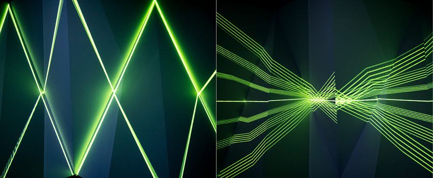 Green laser beams against dark background
