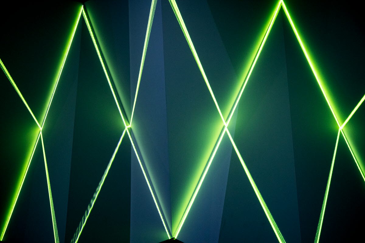 Abstrakta gröna laserstreck