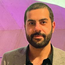 Ansokte på mörkhårig man med skägg